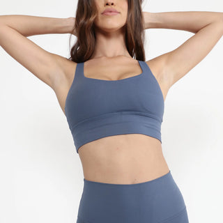 Woman wearing comfortable activewear sports top for exercising