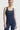 Sleek long jumpsuit blue in model front view - JUV