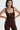 Sleek long jumpsuit brown in model front view close up - JUV