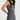 Sleek short jumpsuit gray in model side view close up - JUV