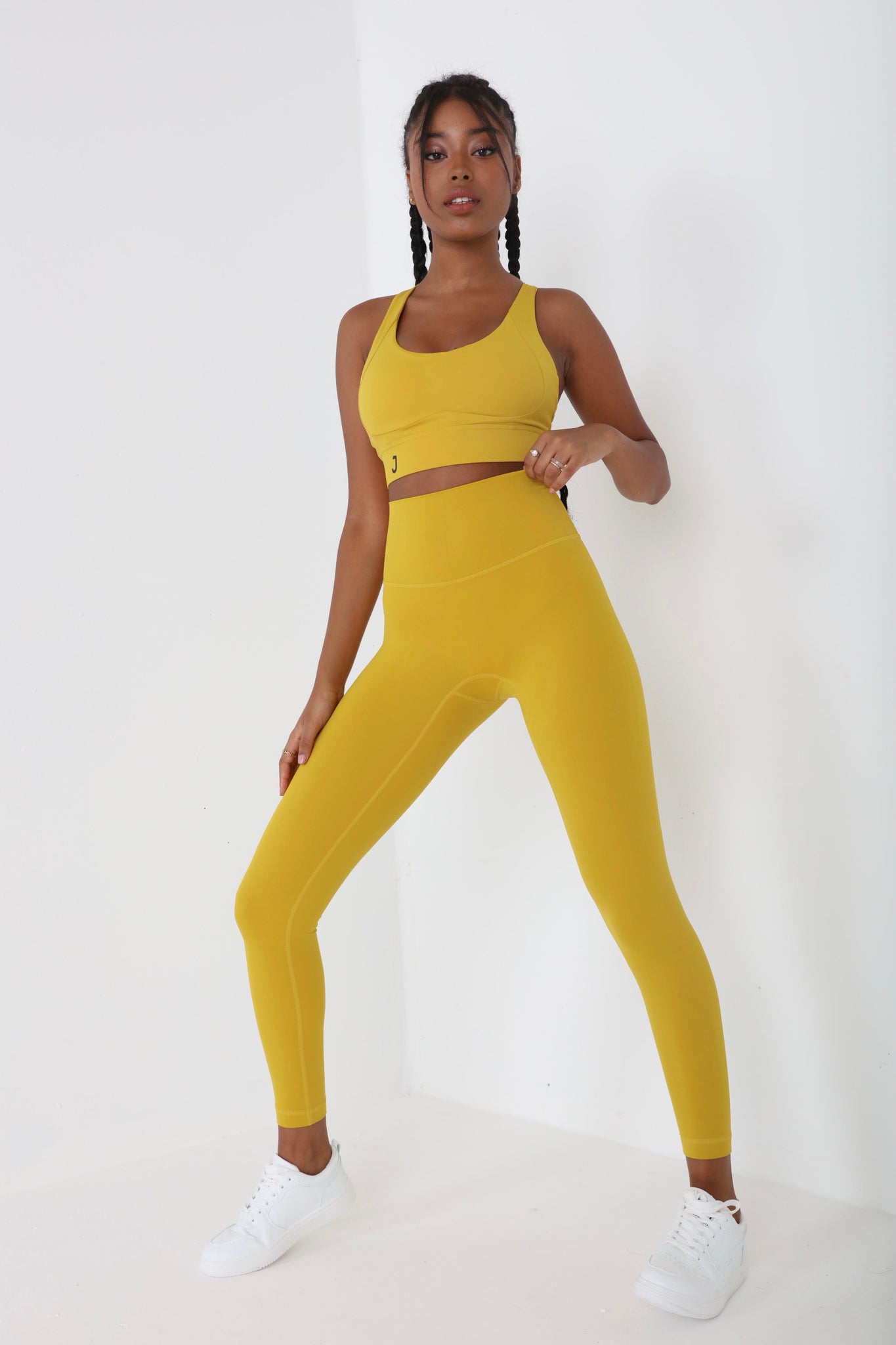 JUV fresh legging in mustard color with matching top, full body front view.