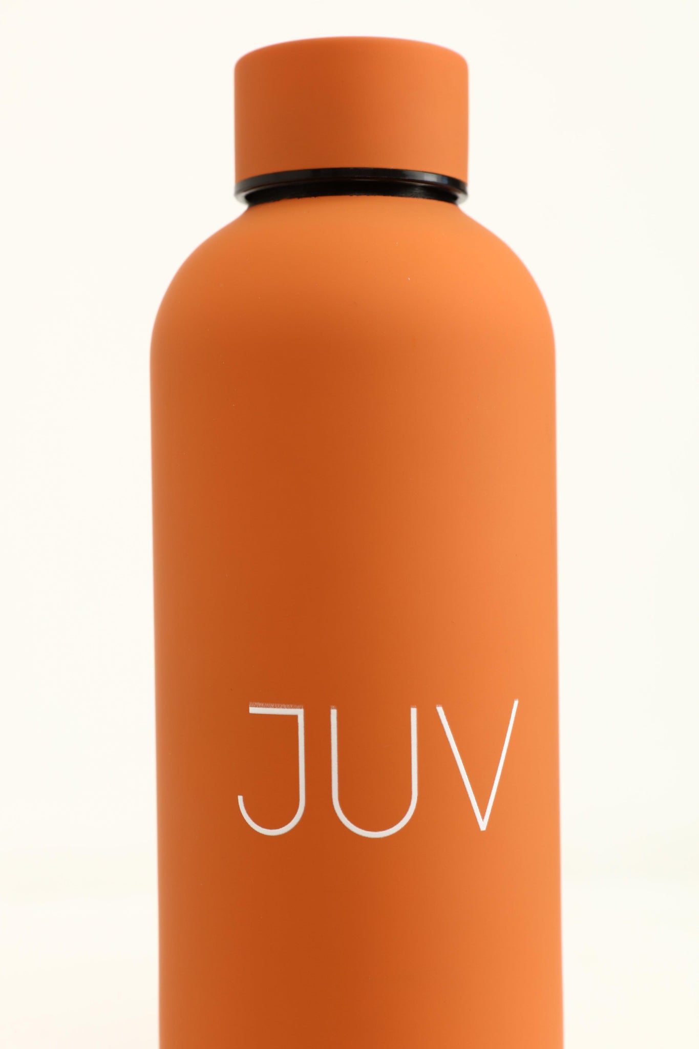 JUV mia thermal bottle in orange, close up front view.